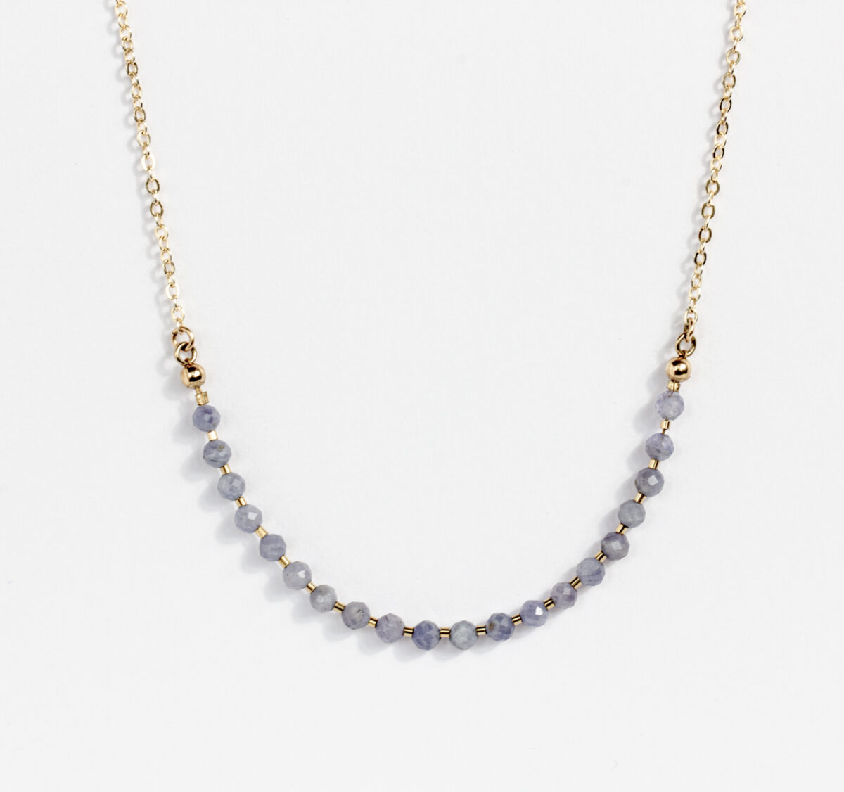 Delicate gold chain necklace with faceted Iolite gemstone beads, handcrafted for a minimalist and elegant look