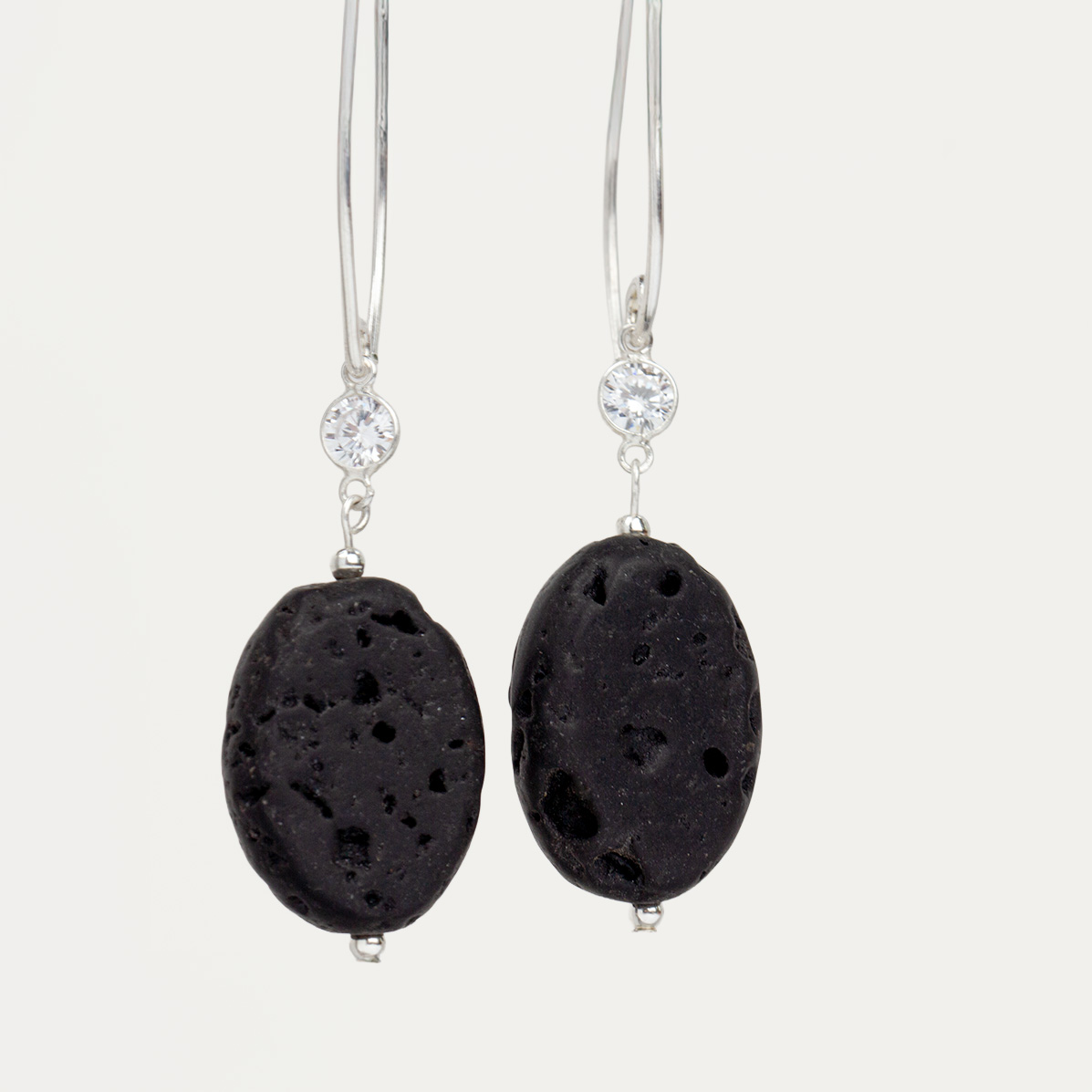 Close-up of Midnight Lava Earrings by AMONTA Jewellery, handcrafted with natural black lava stones, cubic zirconia, and sterling silver. A bold and elegant design matching the Midnight Lava Necklace