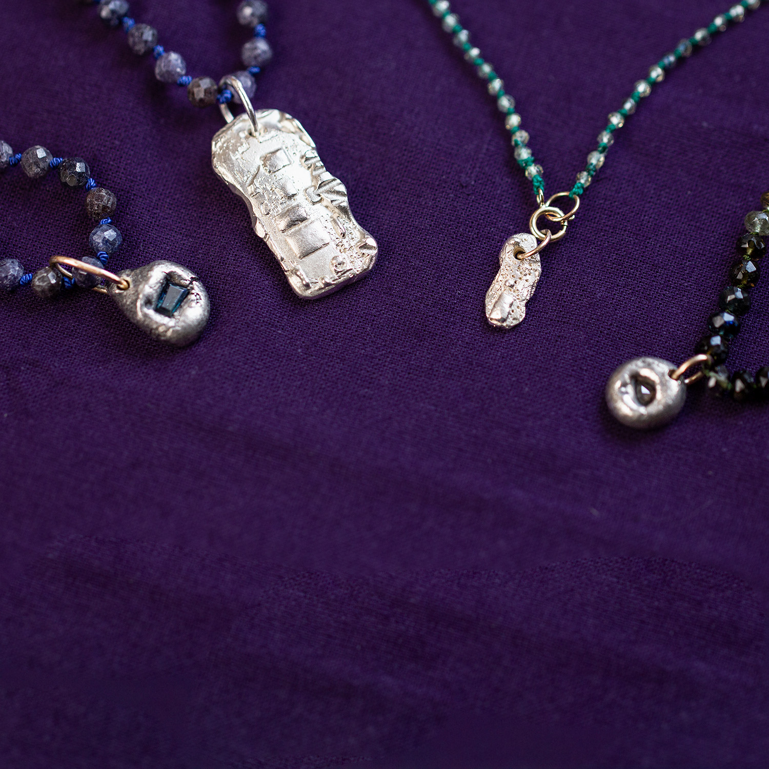 AMONTA KIN bespoke gemstone necklaces with handcrafted silver pendants, designed for all