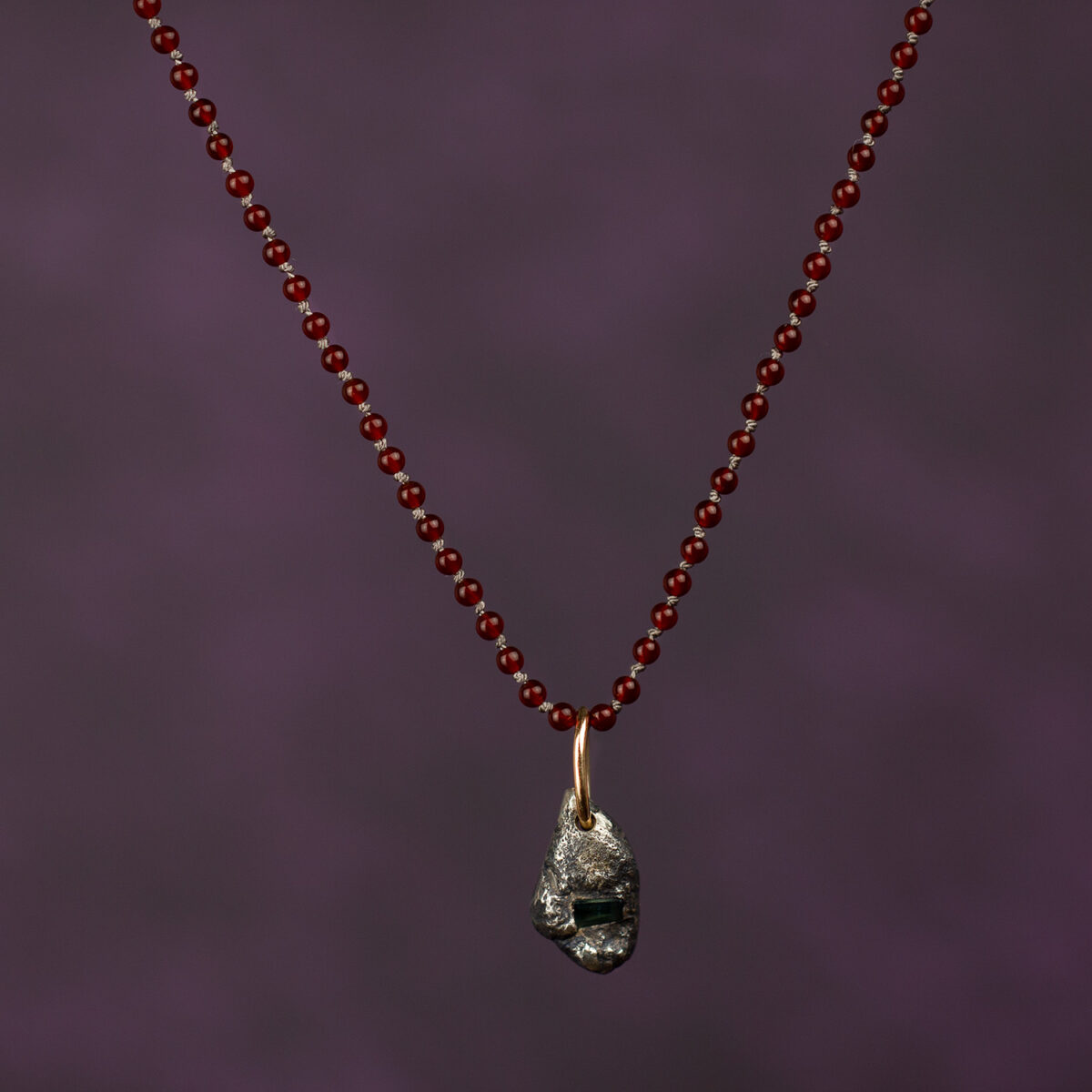 Red carnelian silk necklace with Argentium silver pendant, gold bail and sapphire, bespoke sample by AMONTA jewellery