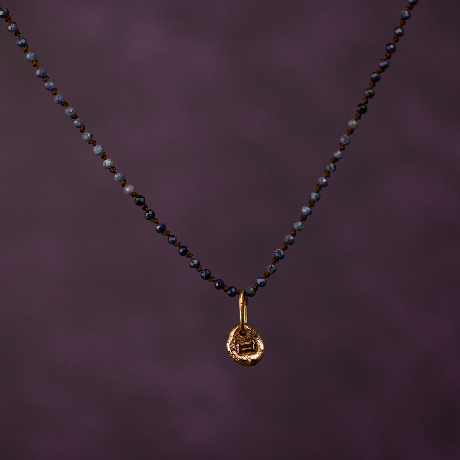 Blue sapphire silk necklace with gold pendant, bespoke sample by AMONTA jewellery